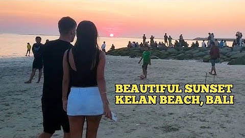Melihat sunset dan pesawat turun di pantai kelan  Bali