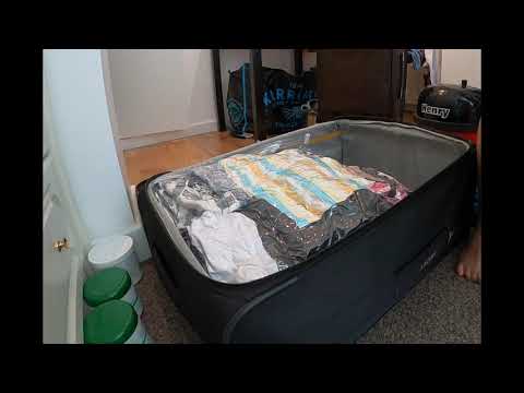 Packing Clothes in Vacuum Bags (timelapse)