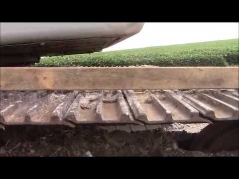 How to: Pas Track Spanning op een Link-Belt Graafmachine
