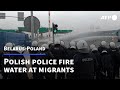 Water cannons fired towards migrants stuck on Poland-Belarus border | AFP