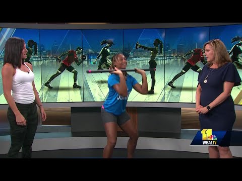 11 Fitness demonstrates how to use a body bar