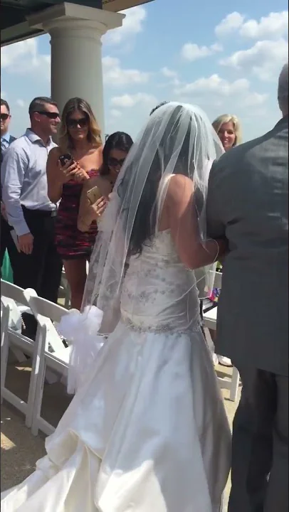 Klaus walks his daughter Courtney down the aisle