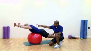 Prone Ball Dumbbell Round the Worlds
