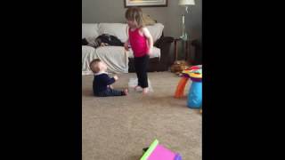 tot girl jumps on bubble wrap