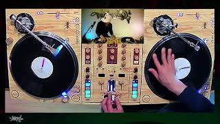 DJ Qbert scratching the "I can break it down" sentence, but over ~135 BPM electro breaks