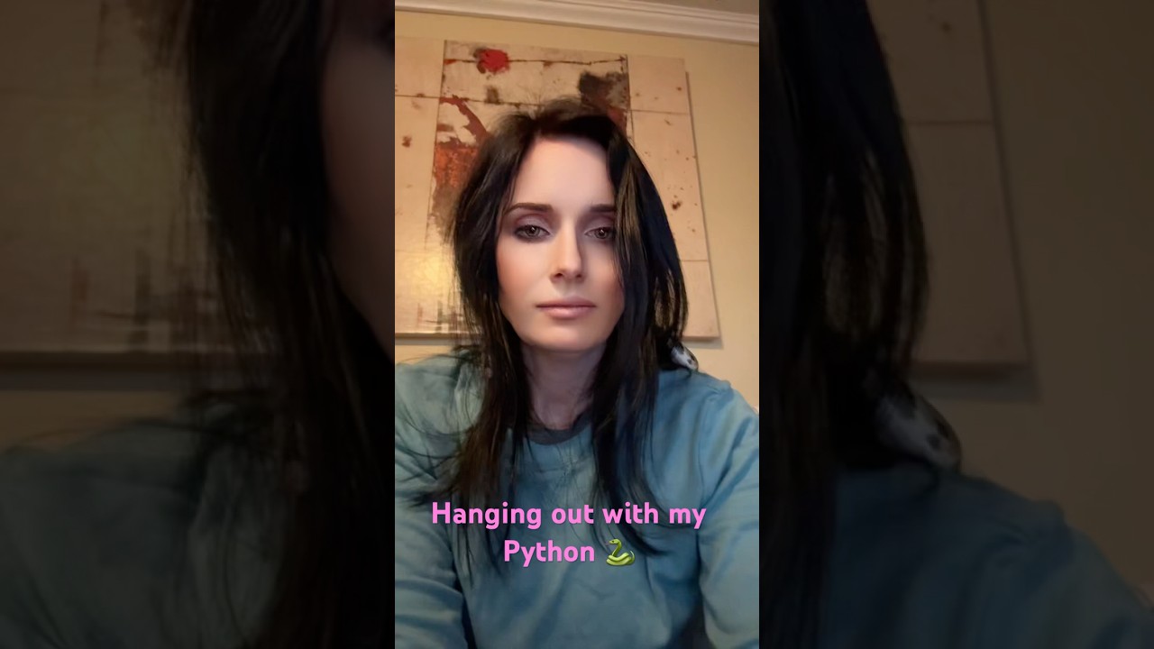 Hanging out with my ball python named Saya. She is a sweet girl 