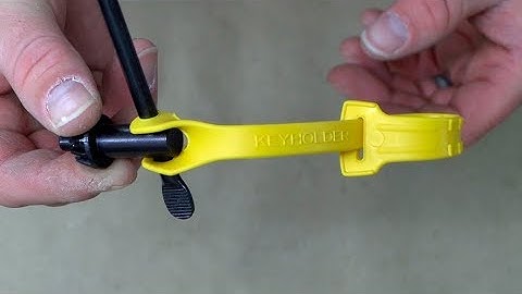 How does the DeWalt Drill Key Holder hold the Chuck Key