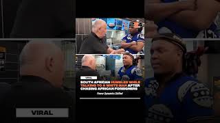 Black South African Zulu warrior humbles when confronting a white store manager in South Africa