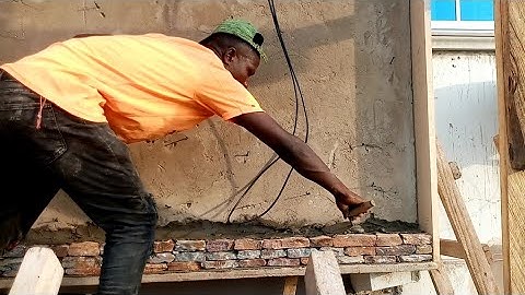 building a house in dawhenya Ghana -  installation of natural Stone Cladding - estate in Ghana