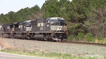 NS E49 with an EMD SD70M leading SD70M-2/C40-9W Notch 8 heads East out of Town