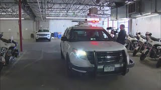 Denver police officers meet with students to discuss traffic safety