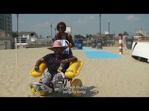 Universal beaches: Elien explains the benefits of ACCESSREC's products at Asbury Park, NJ, USA