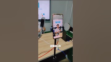 The beautiful man is broadcasting the face thermometer online