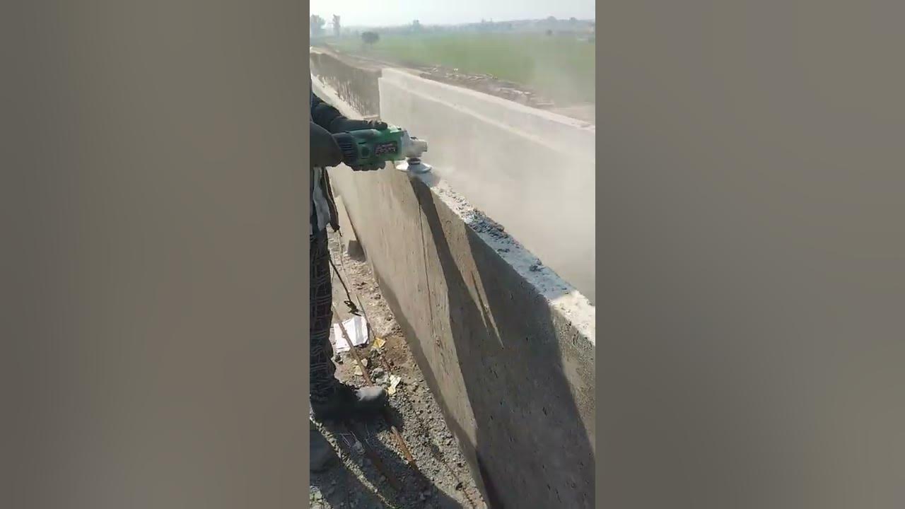 ballast retainer wall offset wall area leveling work . use machine AG5
