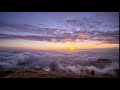 Sunset above the clouds sky timelapse nature scene background loop