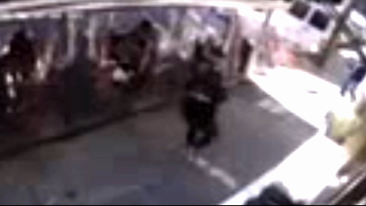 Surveillance video shows moment driver crashes into outdoor dining ...