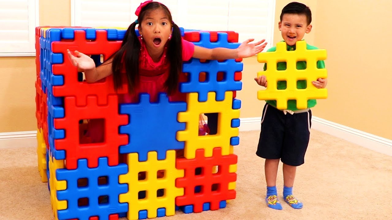 Wendy Pretend Playing with Colored Toy Blocks