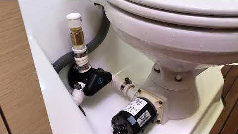 How to clear blockage on a marine head discharge line