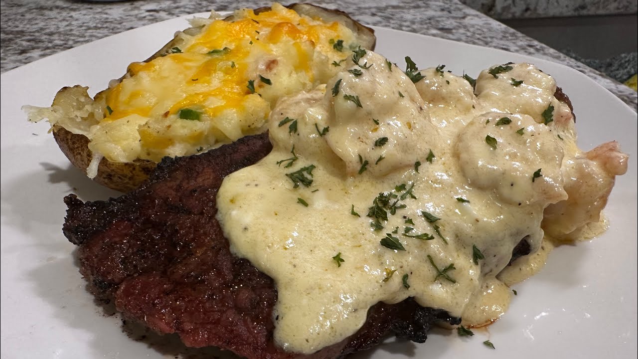 Twice Baked Potatoes and Steak with Shrimp Alfredo sauce! Perfect