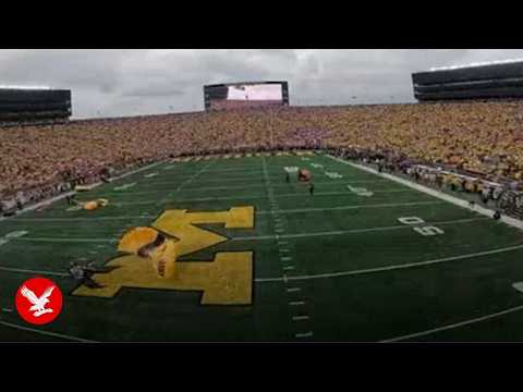 US Army parachute team lands in America's biggest stadium for Michigan game