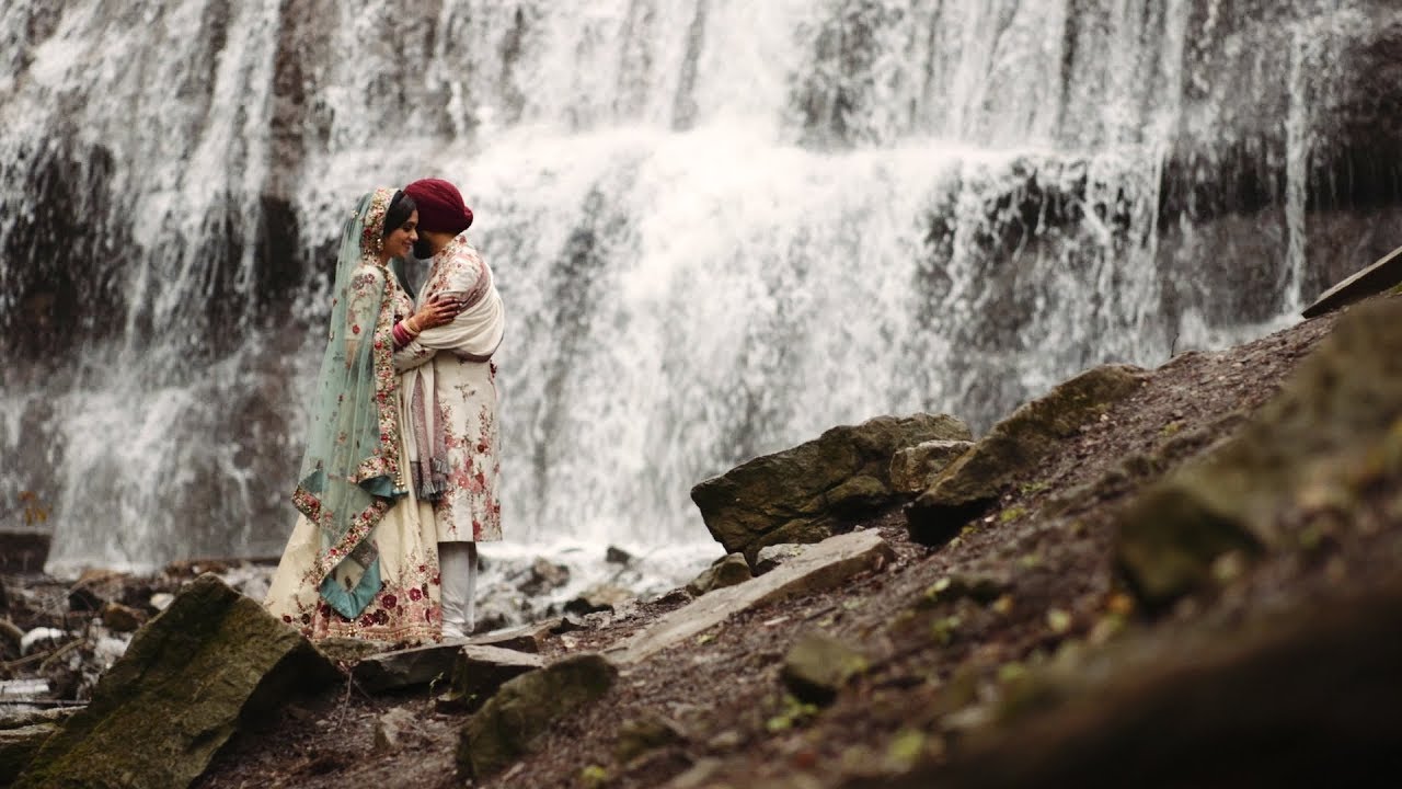 Traditional Sikh couple hike to waterfall on their wedding day.