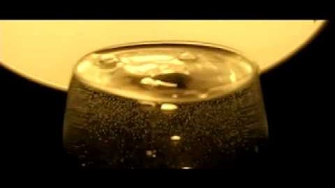 Slow Motion - Ice Cube falling in Water