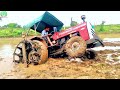 Massey Ferguson 7250 Stuck in Heavy Mud Puddling Time/ John Dheere Pulling Massey  Barely out of Mud
