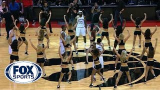 LeBron James and the Cavs surrounded by Toronto Raptors dancers