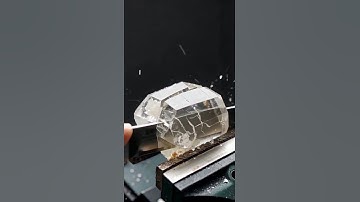 Super-sharp knife slices obsidian, quartz, sapphire, and jade in ultra slow-motion realism.