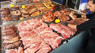 Carnivore Paradise. Giant Grills of Angus Beef, Sausages, Ribs. Street Food @ Biker Fest in Italy