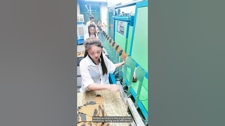 Skilled workers in the production workshop fitting socks efficiently.#amazing #work #workers
