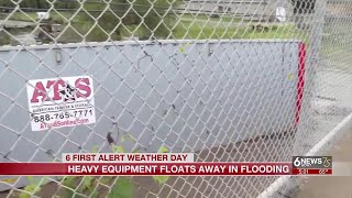 Heavy equipment floats down Douglas County creek due to floodwaters