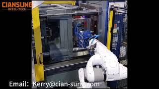 Articulated six degree of freedom robot injection molding machine automation loading and unloading.
