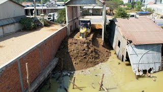 Amazing new project! Komatsu D31P bulldozer showing skills to push dirt In line with the stone wall