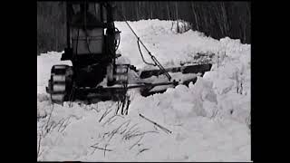 Plowing snow with a TD 6 dozer with wing