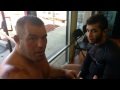 Dean Lister shows how to properly drain ear on Mike Perez