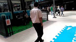 Guy playing The Black Parade Glasgow Central Station