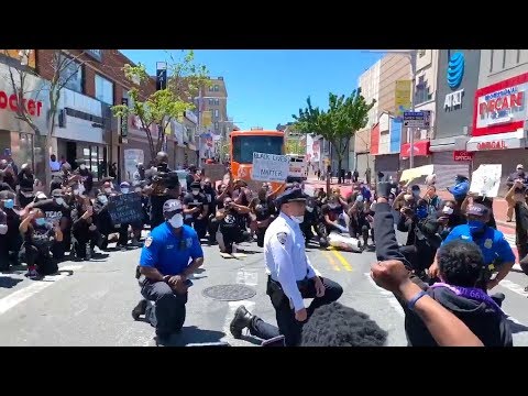 Police Officers Take a Knee With George Floyd Protestors During Peaceful Demonstration