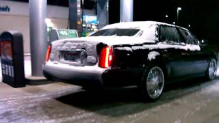 2004 Cadillac De Ville sittin on 20 inch Rims.