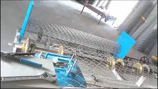 Fully automatic chain link fencing machine