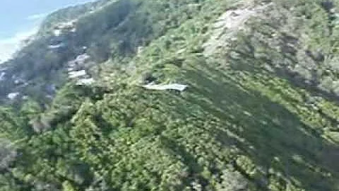 Judy Sahagian and James Bodourian hang gliding ove...