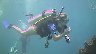 Female Scuba Divers Explores Cavern