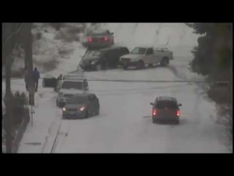 2010 USA Cars sliding and crashing down icy hill in the snow!