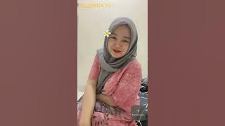 Mom Biti chatting on the bed