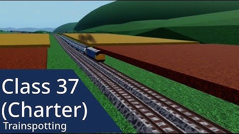 Class 37 (37456) passes a field
