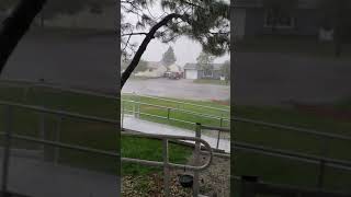 Rain and wind blowing it down the street south of Cheyenne, Wyoming