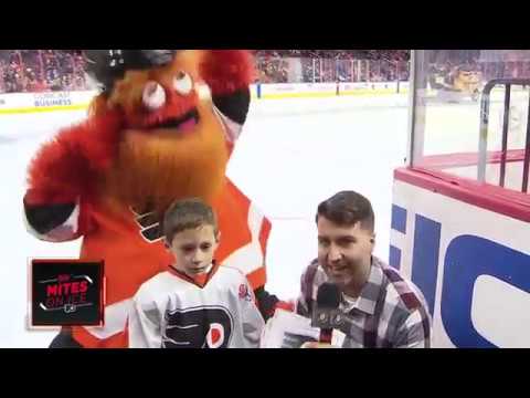 Flyers mascot Gritty meets Ivan Provorov with his dog 