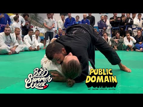 Bruno Malfacine rolling with student at BJJ SUMMER WEEK 2022