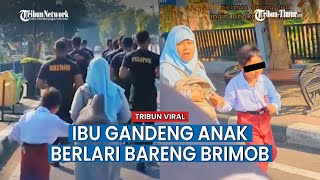 Video BIKIN HARU, Momen Ibu Gandeng Tangan Anaknya Ikut Berlari di Belakang Anggota Brimob