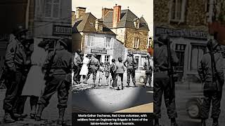 Red Cross volunteer, with soldiers from an Engineering Brigade in front St M  du Mont fountain